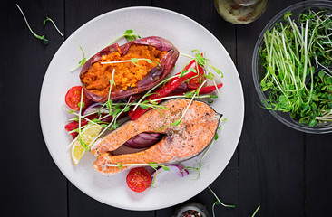 Healthy food: baked salmon and sweet potato and vegetables. Top view , overhead. Diet menu. Copy space