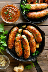Fried sausages in frying pan