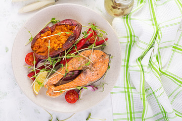 Healthy food: baked salmon and sweet potato and vegetables. Top view , overhead. Diet menu. Copy space