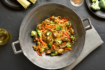 Udon stir-fry noodles with vegetables in wok