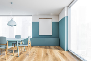 White and blue dining room interior with poster