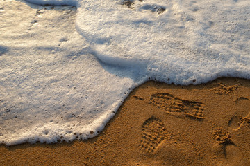 Sea waves on the beach, beautiful soft foam