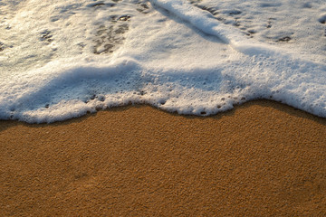 Sea waves on the beach, beautiful soft foam