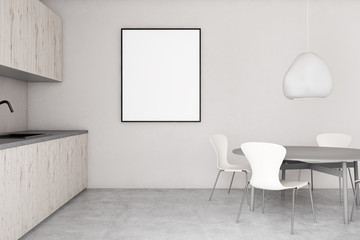 White kitchen with round table and poster