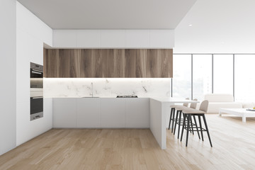 White kitchen and living room with bar