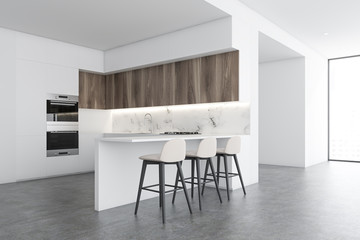 White and marble kitchen corner with bar