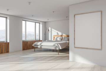 Fototapeta na wymiar White master bedroom corner with poster frame