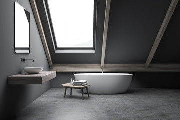 Attic gray bathroom interior with sink and tub
