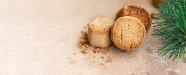 Spanish Christmas traditional sweet Mantecados, soft shortbread with fir tree bunch.Large background for banner