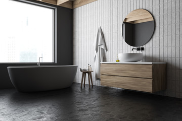Loft gray and white bathroom corner, tub and sink