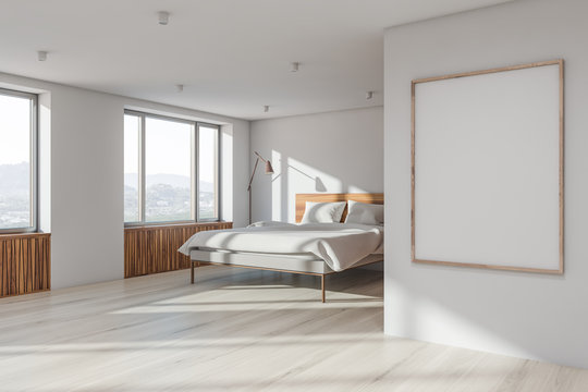 White master bedroom corner with poster frame