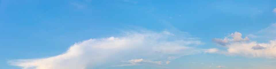 Panorama or panoramic photo of blue sky and white clouds or cloudscape.