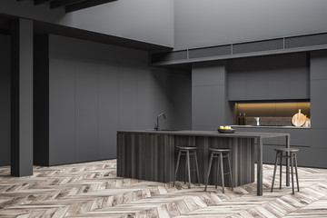 Gray kitchen corner with bar and stools