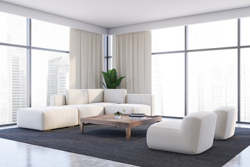 White living room corner, sofa and armchairs