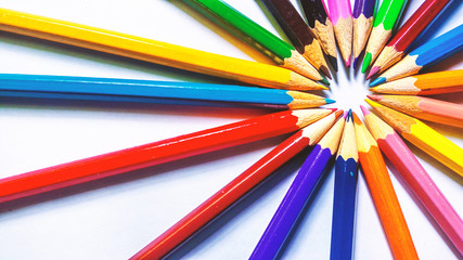 Fototapeta premium Beautiful assorted colored pencils on white background. School collection and stationery.