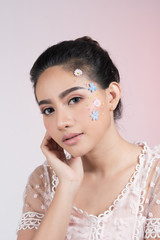 Fashion beauty makeup with flowers on face beautiful woman.