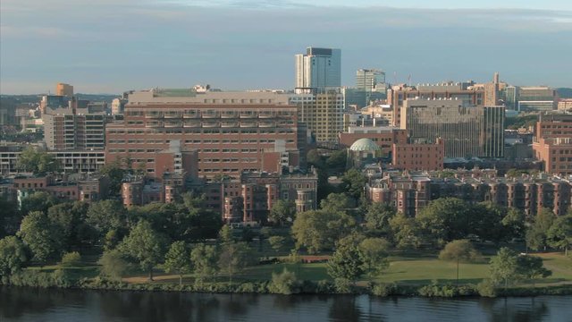 Aerial: flying over Charles River looking out to Boston University. Boston, Massachusetts, USA. 28 August 2019