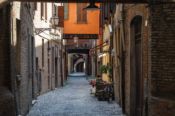 FERRARA / ITALY - JULY 2015: Narrow old street in the historic centre of Ferrara, Italy