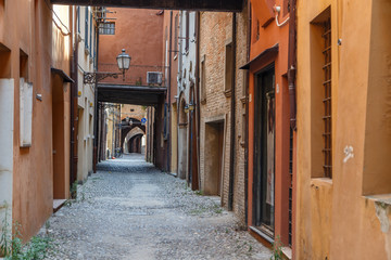 FERRARA / ITALY - JULY 2015: Narrow old street in the historic centre of Ferrara, Italy