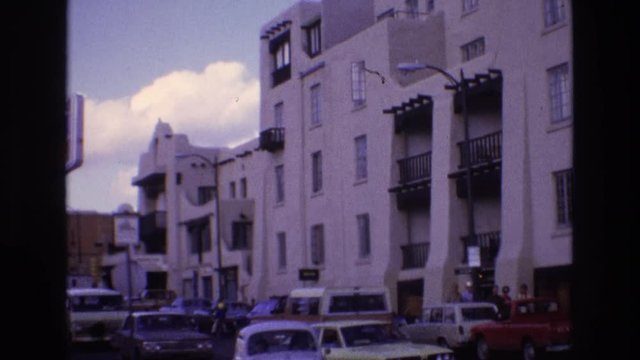NEW MEXICO USA-1973: A Car Turns Down A Street With Near An Adobe Style House