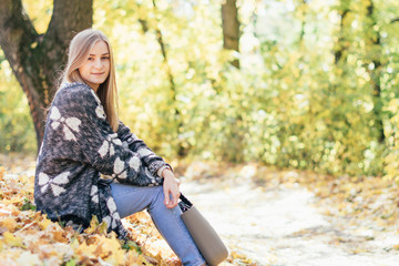 Portrait of young beautiful happy woman, autumn outdoors