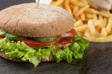  burger with beef, cheese, vegetables and onions. French fries