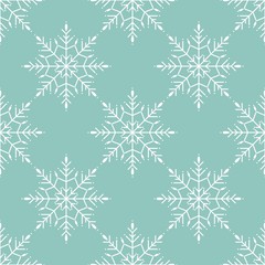 Fototapeta na wymiar Winter seamless pattern with white snowflakes on blue background.