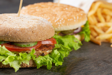 set of burgers. cheeseburger with beef, cheese, vegetables and onions. French fries