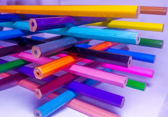 Beautiful assorted colored pencils on white background. School collection and stationery.
