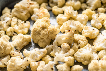 Roasted cauliflower on blue backing tray