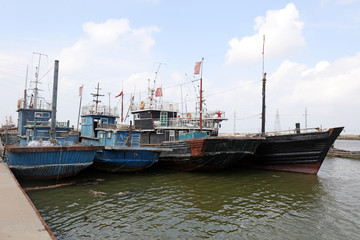 Wooden fishing boats moored on the shore