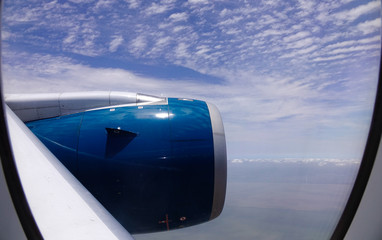 Blue engine of passenger airplane in the sky