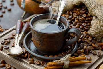 Black coffee on an old background in a cup