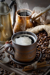 Black coffee on an old background in a cup