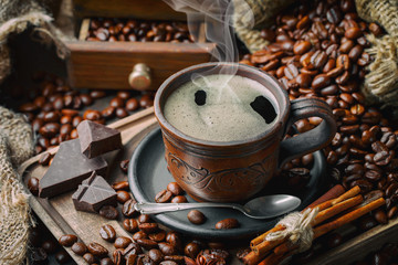 Black coffee on an old background in a cup