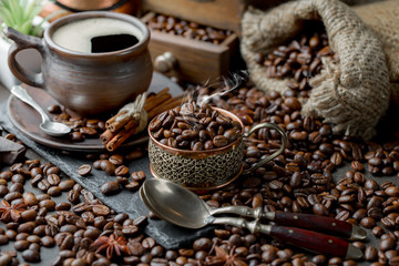 Coffee in a cup and saucer on an old background.