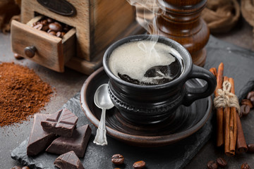 Black coffee on an old background in a cup