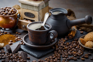 Coffee in a cup and saucer on an old background.