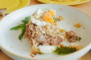 Fried rice with beef, holy basil and thai herb served with poached egg