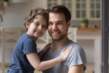 Fototapeta premium Father and little son photo shooting looking at camera