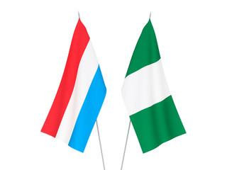 National fabric flags of Luxembourg and Nigeria isolated on white background. 3d rendering illustration.