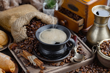 Black coffee on an old background in a cup