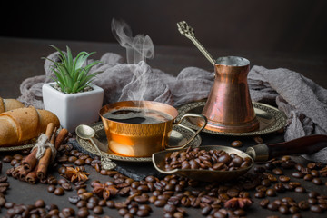 Black coffee on an old background in a cup