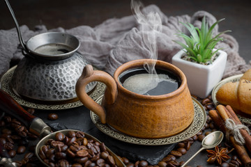 Black coffee on an old background in a cup