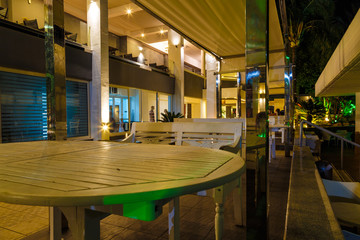 infrastructure of the resort European hotel night, stairs, tables, bar, palm trees, the concept of summer holidays . Greece