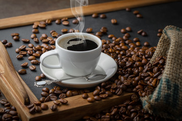 Black coffee on an old background in a cup