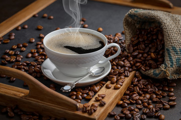 Black coffee on an old background in a cup