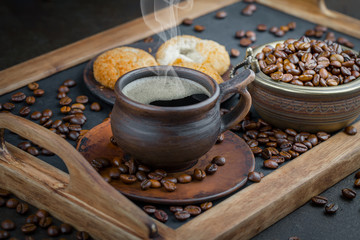 Coffee in a cup and saucer on an old background.