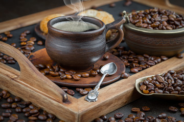 Coffee in a cup and saucer on an old background.