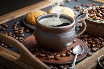 Black coffee on an old background in a cup